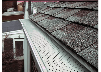 Montreal gutter cleaner Adam's Eaves Gutter/Eavestrough Specialists