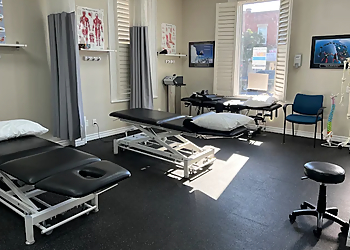 Amiras Ghori, PT, CCMI, AFCI - ACT PHYSIOTHERAPY & HEALTH SERVICES - Milton, ON Physiothérapie - Clinic Interior Image