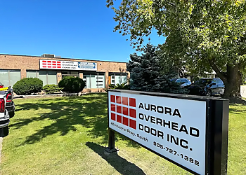 Aurora Overhead Door Inc. Aurora Overhead Door Inc. - Aurora, ON Réparations De Portes De Garage - Service Vehicle Image