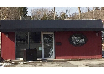 Ajax tattoo shop Closed Casket Custom Tattoos