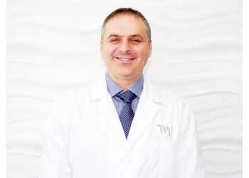 Toronto cosmetic dentist Dr. Charles Triassi - WEST VILLAGE DENTAL CLINIC