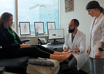 Dr. Jaspaul Riar - DR. RIAR-FOOT & ANKLE CLINIC - Surrey, BC Podiatrists - Doctor Working Image