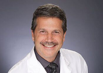 Windsor gynecologist Dr. John Tomc - REVITALIZE MEDICAL LASER CENTRE image 1