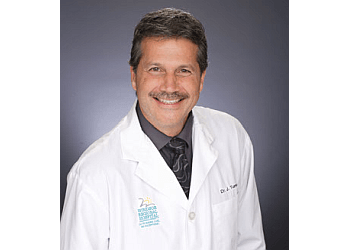 Dr. John Tomc - REVITALIZE MEDICAL LASER CENTRE