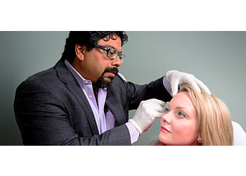 St Johns dermatologist Dr. Kamal Ohson - KARMADERM COSMETIC DERMATOLOGY image 1