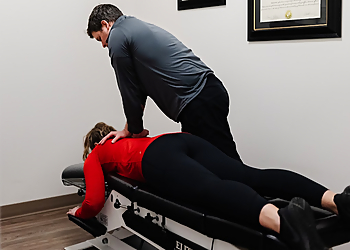 Dr. Matthew McCabe - PEACH PHYSIOTHERAPY & WELLNESS CENTRE - Chatham, ON Chiropractors - Doctor Working Image