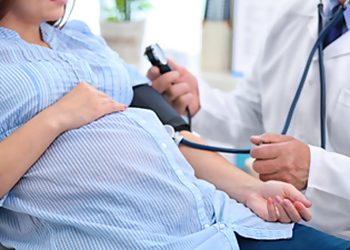 Dr. Ramadan El Sugy Dr. Ramadan El Sugy - Brampton, ON Gynecologists - Doctor With Patient Image