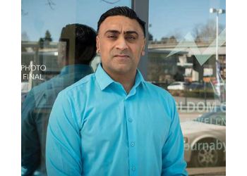 Burnaby chiropractor Dr. Ron Uppal, DC - HOLDOM CHIROPRACTIC & WELLNESS CENTRE 