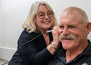 Fischer Hearing - Regina, SK Audiologists - Doctor With Patient Image
