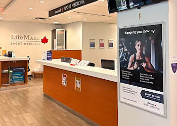 Lucjan 'Lu' Burzynski, MPT - LIFEMARK SPORT MEDICINE RICHMOND OVAL - Richmond, BC Physical Therapists - Reception Area Image
