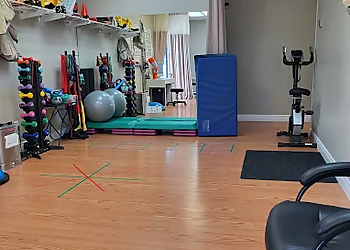 Nandhini Arjunan, PT - SK PHYSIOTHERAPY & SPORTS INJURY CLINIC - Cambridge, ON Physical Therapists - Clinic Interior Image